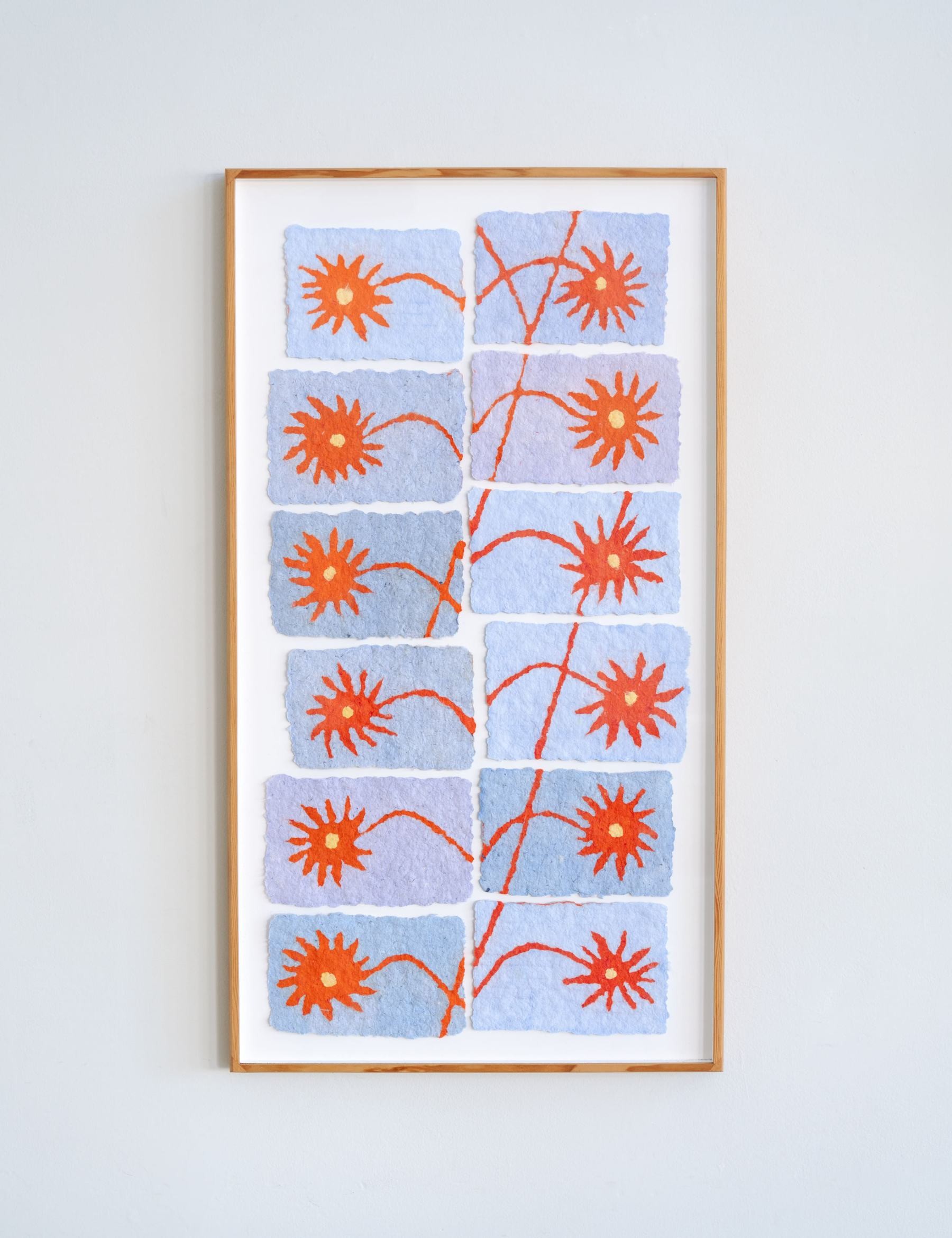 paper pulp painting of red flowers made from recycled cotton t-shirts