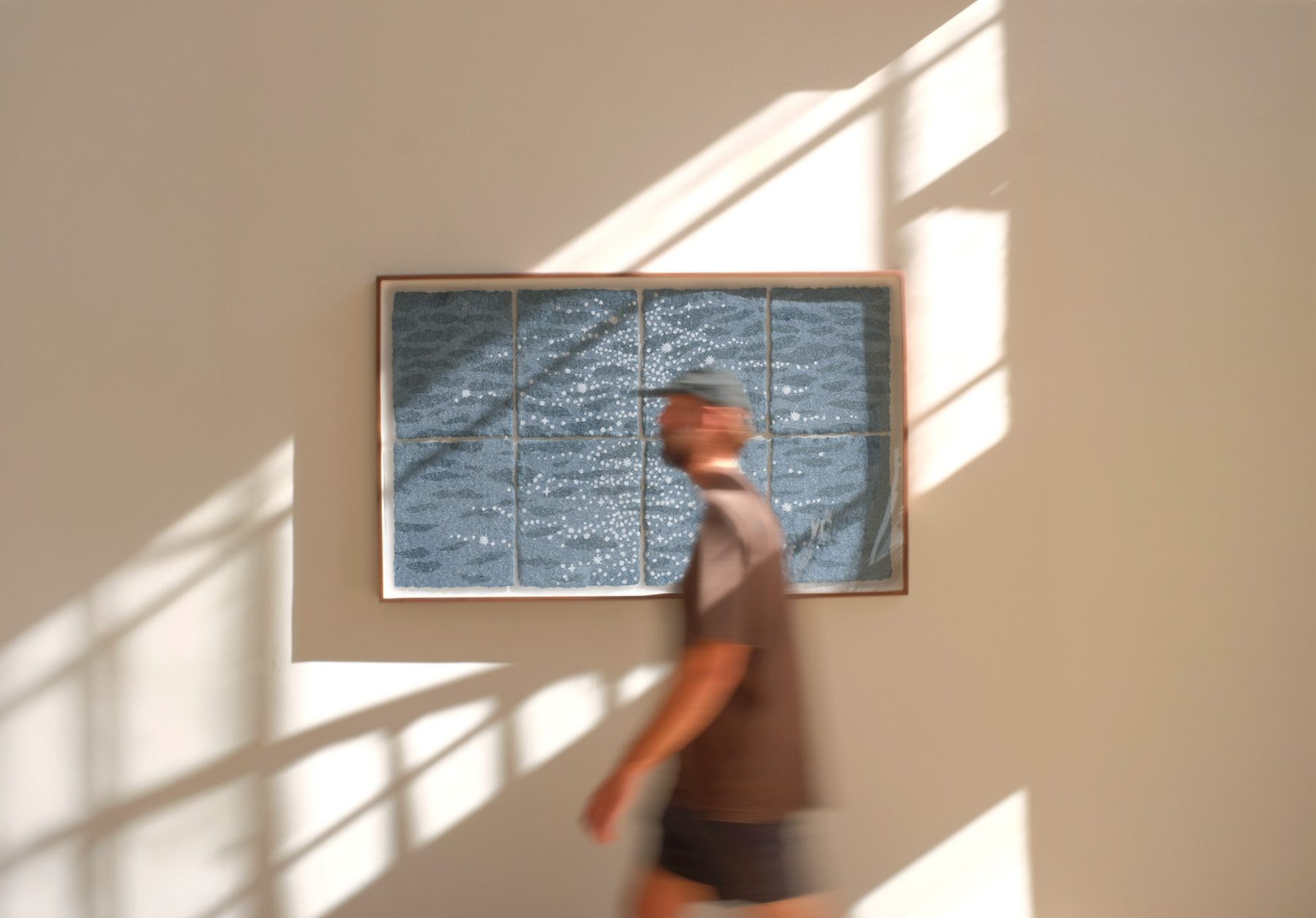 large paper pulp painting of a big ocean shimmer made from discarded denim jeans