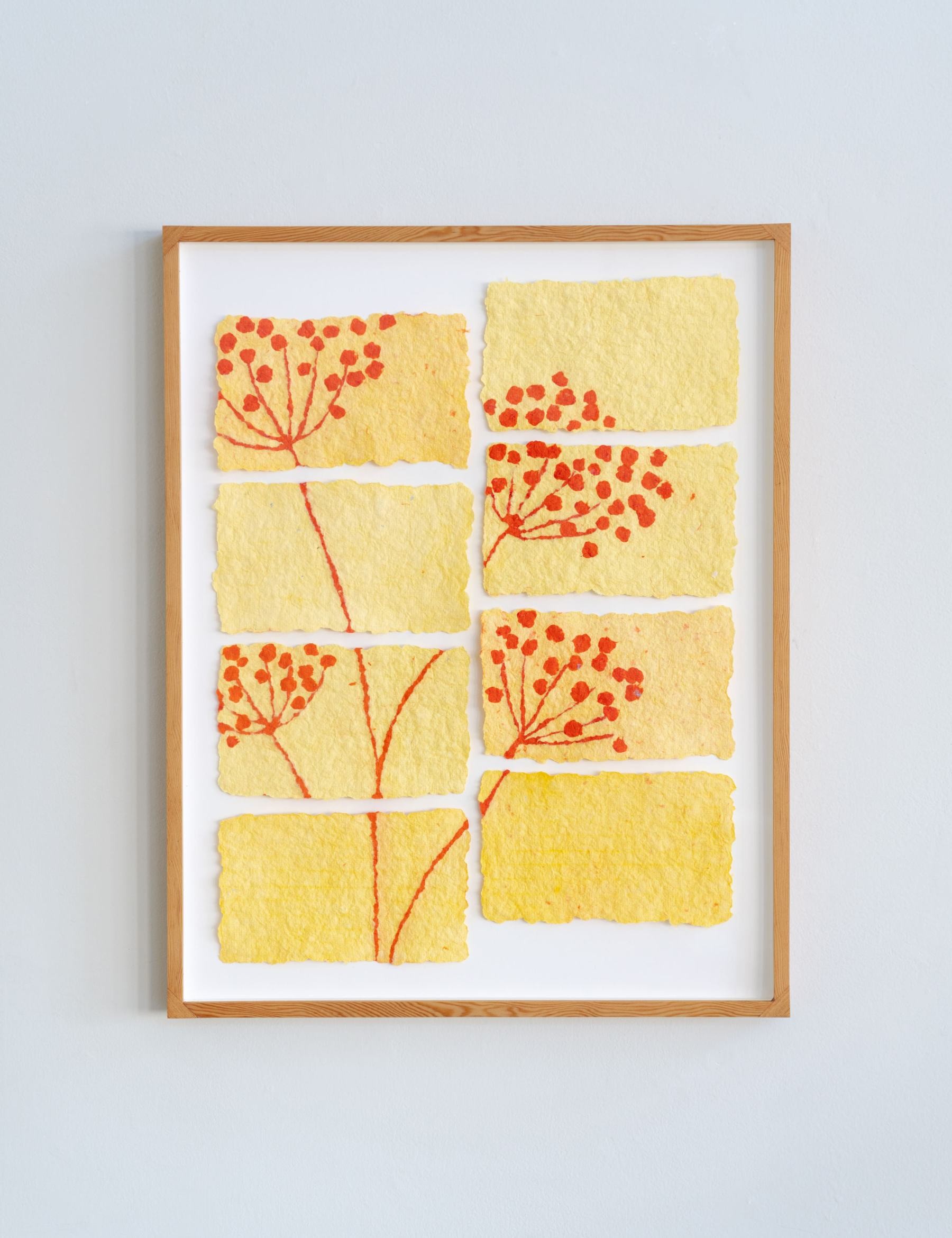 paper pulp painting of a bright red and yellow fennel plant, tiled