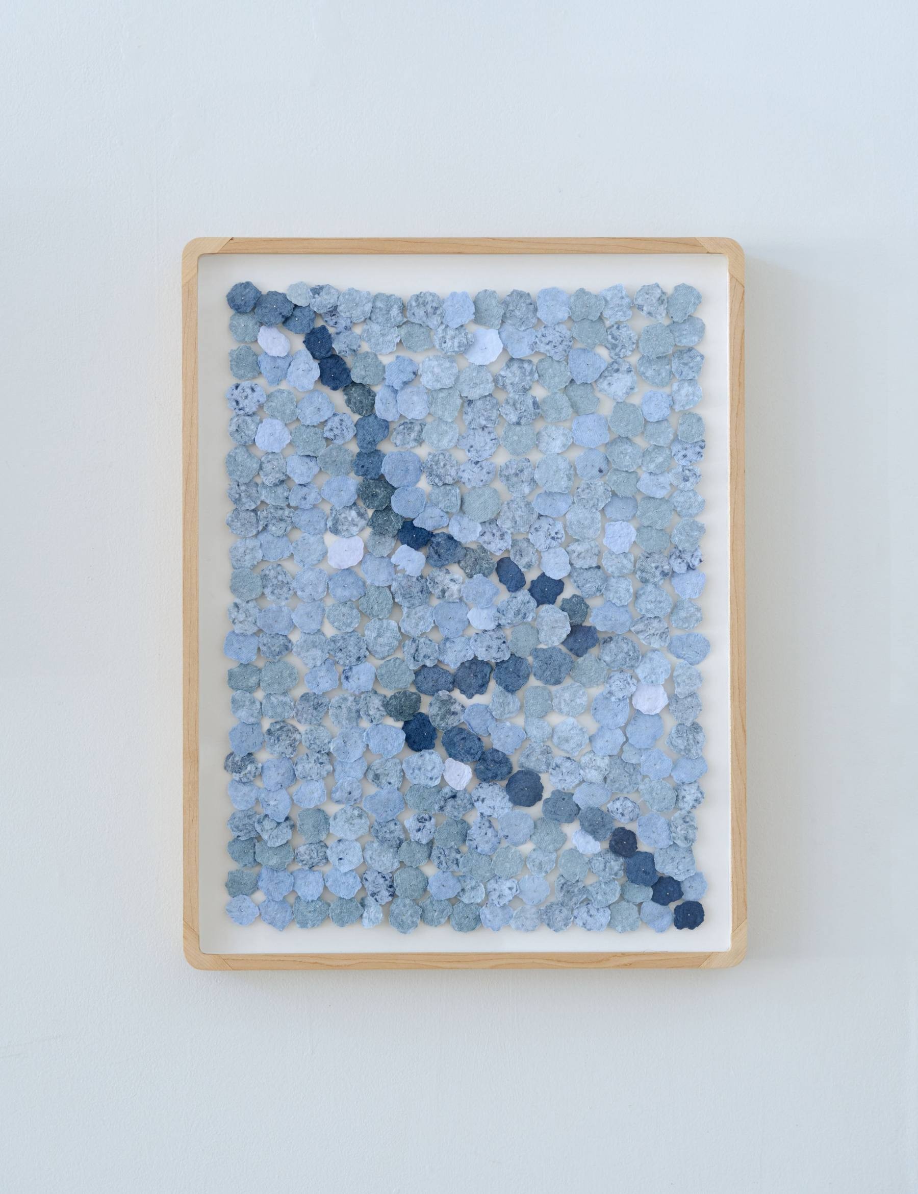 paper pulp piece titled weaving, made from discarded denim jeans